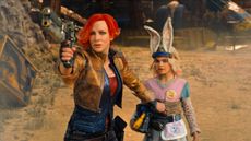 Lilith (Cate Blanchett) levels a pistol, standing in front of Tiny Tina (Ariana Greenblatt) in the "Borderlands" movie